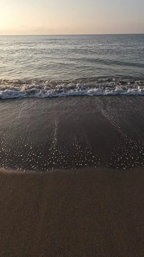 Shore of a beach with the waves caressing the sand Stock Footage 285231554
