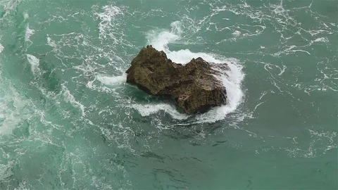 A shore boulder and waves Stock Footage 72447009