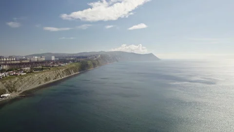 The shore with the cliff meets the sea Stock Footage 263698661