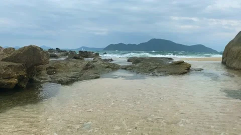 The shore is covered with small foam waves. Stock Footage 236692953