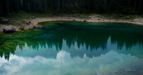 Shore of Lake Carezza Stock Footage 115127191