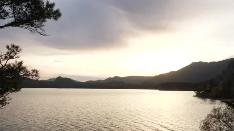 Shore of the lake in the rays of the setting sun Stock Footage 219966403