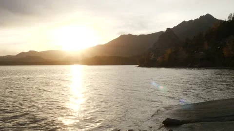 Shore of the lake in the rays of the setting sun Stock Footage 219966419