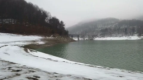 On the shore of a lake in winter Video stock 102888813