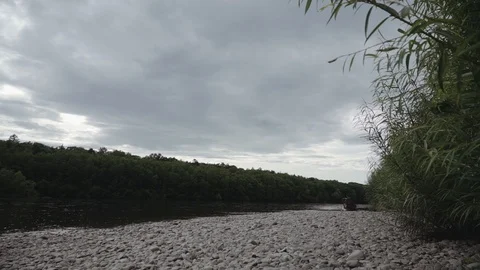 Shore of the mountain river at sunset Stock Footage 120495652