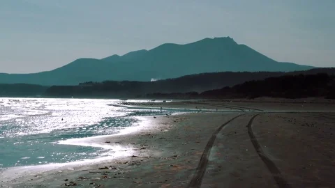 Shore of the ocean in the background of the hills  Stock Footage 84005706