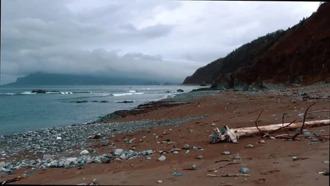 Shore of the ocean in the background of the hills  Stock Footage 84006020