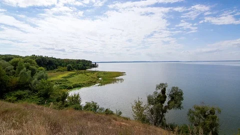Shore of the river on a sunny day time lapse Stock-Footage 108556612