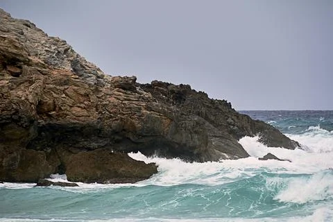 Shore rocks battered by waves. Mediterranean sea Stock Photos