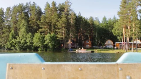 Shore of the shore through the side of the swinging boat, floating Stock Footage 96397109