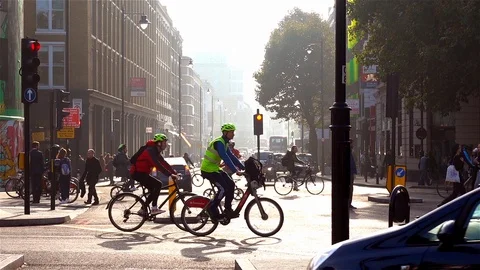 Shoreditch, London UK 10/16/2018: Cyclists crossing at traffic light Stock Footage