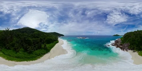 Shoreline with emerald waves and dense forest. Mahe, Seychelles. Stock Footage 308147641