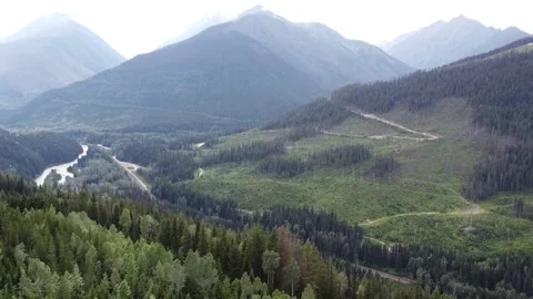 Short Aerial Reverse Drone Landscape Shot of Mountain Valley &amp; Kinbasket Lake Stock Footage 248905910