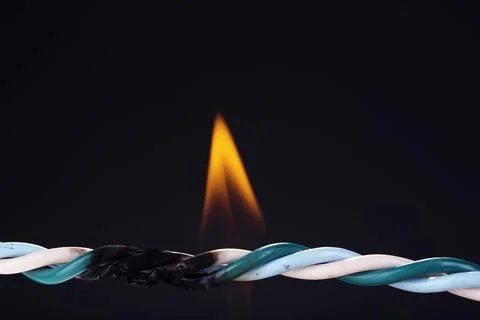 Short circuit, burnt cable, isolated on black Stock-Fotos