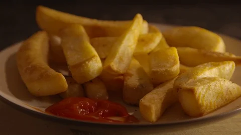 Short clip of a chip being dunked into ketchup Stock Footage 87857541