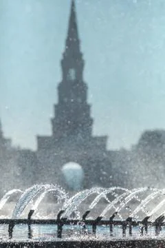 Short focus at the jets and splashes of the fountain in the back sunlight in  Stock Photos