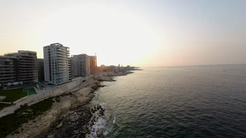A short FPV drone flight along the coast of a modern city Stock Footage 248783975