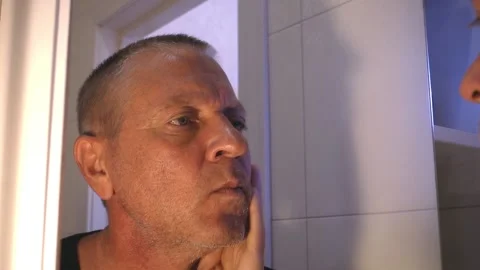 A short-haired man in a black T-shirt wants to shave, Stock Footage 162211609