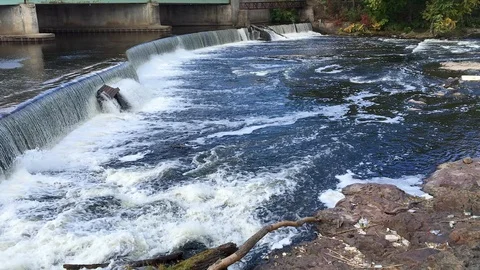 Short, Man-Made Waterfall Next To Bridge Stock Footage 98416245
