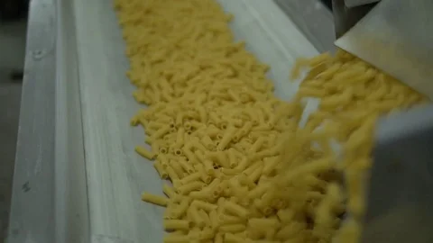 Short pasta production line, the camera moves from the bottom up Stock Footage 75218172