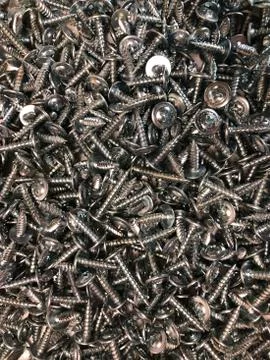 Short silver screws Stock Photos