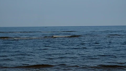 Short, small waves run to the shore. Stock Footage 120758525
