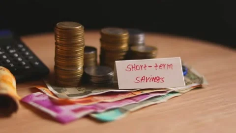 Short term saving writing and indian coin and cash(note) collection beautiful Stock Footage 155923330