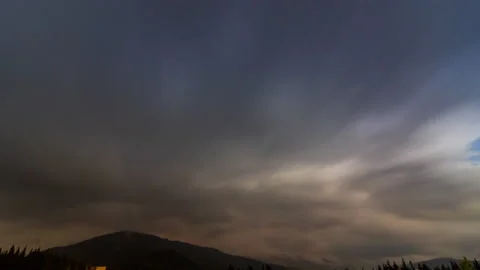A short time lapse of a cloudy night on Carpathuan Mountauns Stock Footage 138120693