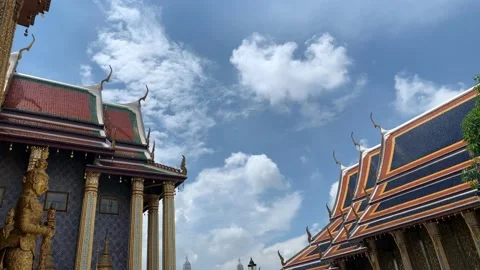 Short time lapse of sky between two Buddhist temples with cumulus clouds Stock Footage 133547878