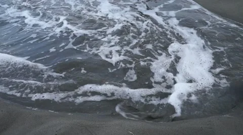 A short video of waves crashing over a broken beach pipe. Video stock 46702006