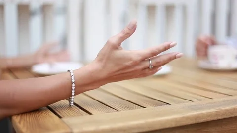 Short wave gestures women's hands at the table and falling Cup - close-up Stock Footage 81062937