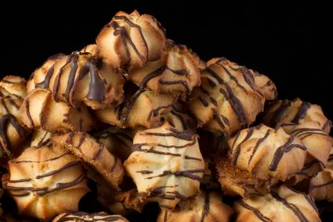 Shortbread cookie with chocolate icing on a dark background Stock-Fotos