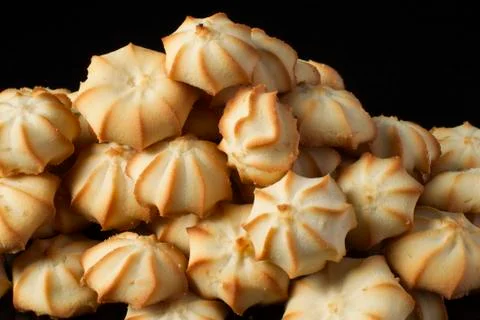 Shortbread cookie closeup on a dark background Stock Photos