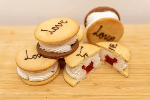 Shortbread cookies with cream and love inscription Stock Photos