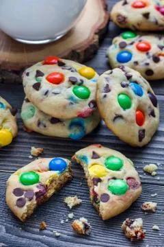 Shortbread cookies with multi-colored candy and chocolate chips on wooden tab 스톡 사진