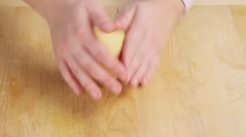 Shortbread pastry being shaped into a ball and wrapped in cling film Vídeos de archivo 24657218
