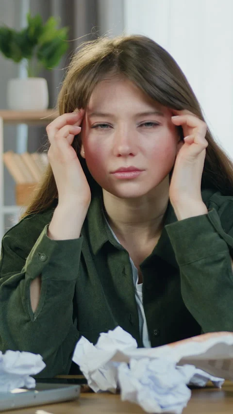 Shortcomings of overtime work where upset fatigued 25-aged female worker sitting Stock Footage 328939911