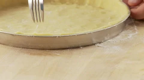 Shortcrust tart base being pierced with a fork Stock Footage 24642129