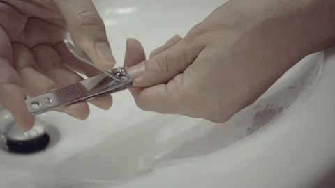 Shorten fingernails with clipper, Close-up Stock Footage 121231756