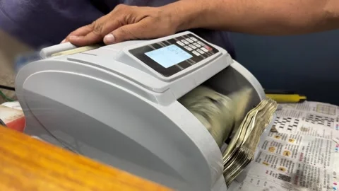 Shot of 500 Indian rupees banknotes in cash counting by machine Stock Footage 340478751
