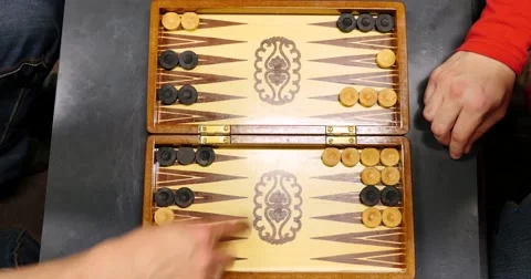 A shot from above of two players playing backgammon Stock Footage 55325418