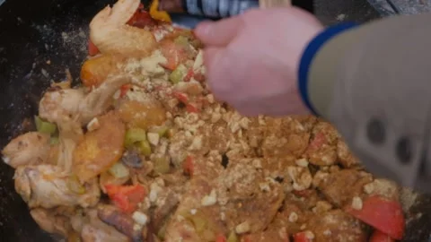 Shot of adding spices to a dish slow motion. Spices are added to the dish in the Stock Footage 284173979