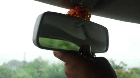 Shot of adjusting rearview mirror Stock Footage 156954355