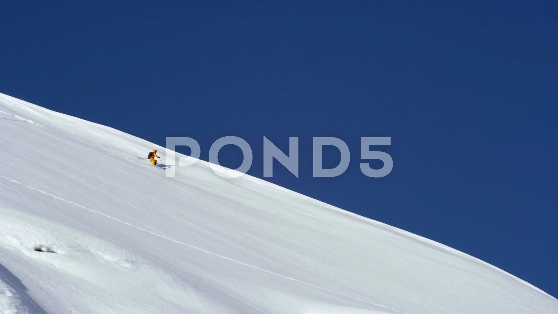 https://images.pond5.com/shot-afar-skier-sliding-down-footage-129119881_prevstill.jpeg