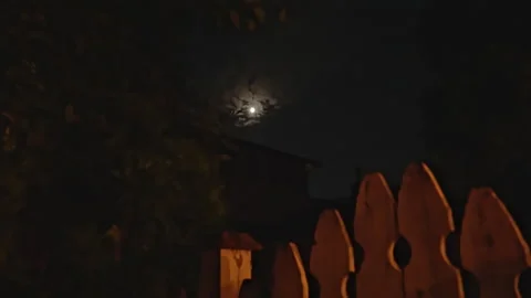 Shot of an almost full moon shining brightly through the clouds 스톡 동영상 265133784