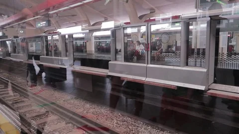 A shot of the arrival of a train in the subway through glass doors Stock-Footage 115723655