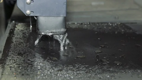 Shot of automatic cut sheet metal mechanism with liquid cooling and water splash Stock Footage 111247540