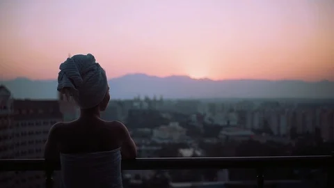 Shot back amazing view young silhouette woman with a wrapped towel on his head Stock Footage 99667984
