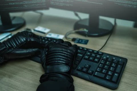 Shot from the Back to Hacker Breaking into Corporate Data Servers from His Un Foto stock