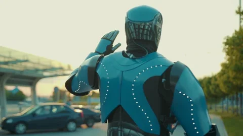 Shot back humanoid robot waving his hand to the bus on street in the city future Stock Footage 133630984